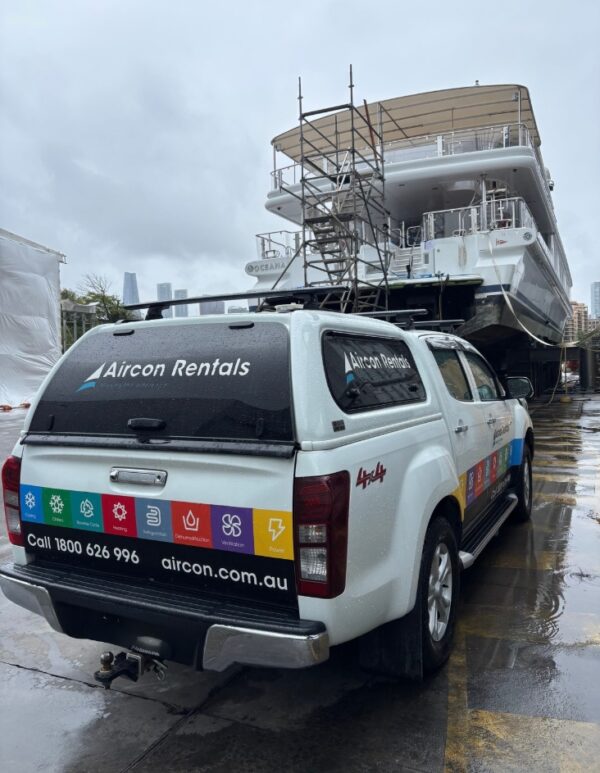 Aircon Rentals vehicle on-site at dry dock providing marine HVAC hire for luxury yacht maintenance.