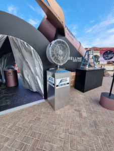 Industrial misting fan hire setup at outdoor event for cooling and comfort.